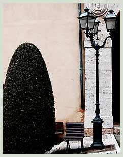 Italian lamp and resting place in Sarteano square